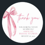 Blush Pink Bow She's Tying the Knot Bridal Shower Classic Round Sticker<br><div class="desc">This charming bridal shower theme exudes elegance and romance with its delicate blush pink hues and intricate bow details. It's perfect for celebrating the bride-to-be as she embarks on the journey of tying the knot. From the invitations to the decorations, every aspect of this theme radiates sophistication and joy. Embrace...</div>