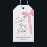 Blush Pink Bow She's Tying The Knot bridal Shower Gift Tags<br><div class="desc">Add a charming touch to your celebration with the Blush Pink Bow "She’s Tying the Knot" Bridal Shower Favour Tags! Featuring a chic bow design and customisable text,  these elegant tags are perfect for personalising favours and thanking guests in style.</div>