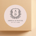 Blush Pink Crest Modern Monogram Wedding  Classic Round Sticker<br><div class="desc">Add a soft, elegant touch to your wedding with the Blush Pink Crest Modern Monogram Wedding Classic Round Sticker. Featuring a gentle blush pink background, a delicate crest design, and a personalised monogram, this sticker is perfect for enhancing your wedding invitations, favours, or decor. Its romantic and modern style makes...</div>