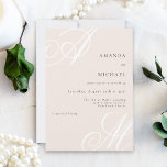 Blush Pink Modern Elegant Minimal Monogram Wedding Invitation<br><div class="desc">A chic modern design with an edge, this modern minimal wedding invitation features beautiful calligraphy script monograms of the bride and groom on alternate corners. A neat text layout displays the details of your wedding with a clean classic look with large white initials and black text over a beautifully soft...</div>