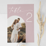 Blush Pink Wedding | Elegant Soft Rose Arch Photo Table Number<br><div class="desc">Add a soft, romantic touch to your wedding decor with this blush pink table number card. Designed with elegant script text and a customisable arch shape photo section, this soft rose minimalist design is perfect for couples planning a modern, boho, or spring summer themed wedding. Ideal for those who appreciate...</div>