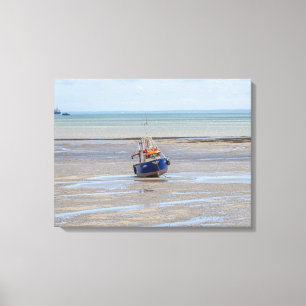 Boat at low tide view canvas print
