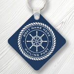 Boat name and hailing port nautical ship's wheel key ring<br><div class="desc">Keychain featuring a white,  elegant ship's wheel and rope emblem with custom boat name and hailing port (or other custom text) on a dark blue background.</div>
