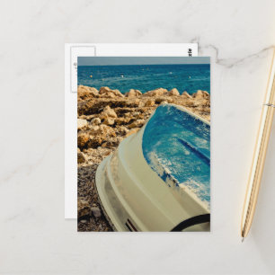 Boat with sea in background postcard
