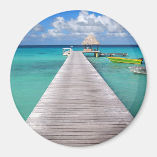 Boats at a jetty in the Pacific round magnet