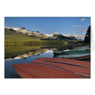 Boats parked on the lakeshore of Maligne Lake,