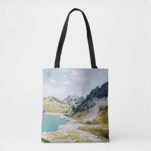 BODY OF WATER SURROUNDED BY MOUNTAINS TOTE BAG