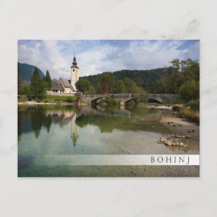 Bohinj lake with church in Slovenia bar postcard