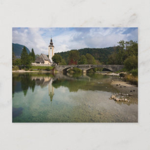 Bohinj lake with church in Slovenia postcard
