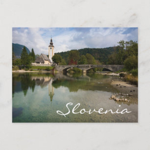 Bohinj lake with church in Slovenia text postcard