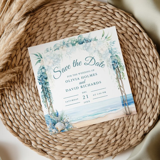 Boho Coastal Floral Arch Wedding Save the Date (Boho Coastal Floral Arch Wedding Save the Date on a boho wedding table.)