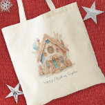 Boho Gingerbread House Name Merry Christmas Tote Bag<br><div class="desc">Boho Gingerbread House Name Merry Christmas Add a special extra touch to your holiday gift wrapping with this handy keepsake tote with a whimsical bohemian style gingerbread home watercolor illustration in shades of creams, pinks! Easily personalise with your greeting and receipient's name. he same design is on the back and...</div>