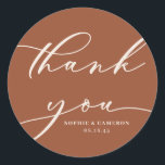 Boho Terracotta Calligraphy Wedding Thank You Classic Round Sticker<br><div class="desc">Send thanks with this customisable script thank you stickers. It features modern calligraphy and classic typography with a terracotta background. Personalise this script thank you sticker by adding your own details. This terracotta thank you card will be perfect for wedding favours and as an envelope seal.</div>