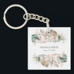 Boho Tropical Orchid and Monstera Keychain<br><div class="desc">Make your keys a little more special with this personalised wedding keychain from the Tropical Garden Collection. One side features the names of the happy couple in a boho font, while the other side showcases a beautiful tropical bouquet of orchids, monstera leaves, palm leaves, and dried palm leaves. The design...</div>