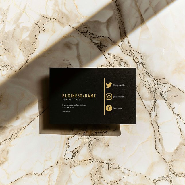 Bold black and gold social media icons business card (Black business card with gold text, minimalist layout, and social media icons.)