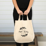 Bold Branch Wedding Monogram Tote Bag<br><div class="desc">Custom printed tote bags make a fun and functional wedding favour your guests will love! Personalise the template with the bride and groom's names or monogram initials. Add your wedding date, the city, state or venue name or any other custom text. This modern rustic logo-style design has bold leafy branches...</div>