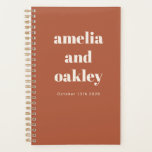 Bold Minimalist Rust Orange Retro Custom Wedding Planner<br><div class="desc">Stay organised while planning your big day with this Personalised Wedding Planner. Featuring a modern minimalist design in earthy rust terracotta with bold typography, this spiral-bound notebook is perfect for jotting down ideas, timelines, and to-do lists. With customisable names and date details, it makes a thoughtful engagement gift for newlyweds-to-be....</div>