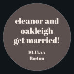 Bold Typography Warm Brown Modern Wedding Custom Classic Round Sticker<br><div class="desc">This personalized wedding sticker in brown features bold modern typography with a warm,  minimalist layout. Customize the names,  date,  and location to match your celebration details. A versatile option for wedding favors,  envelopes,  welcome bags,  and day-of decor. Designed to coordinate seamlessly with modern and neutral wedding styles.</div>
