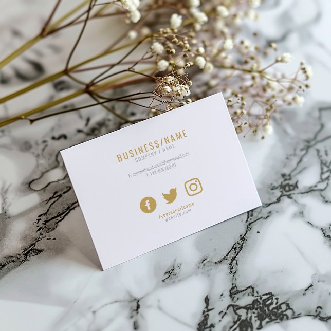Bold white and gold social icons business card (White business card with gold text, minimalist contact details, and social media icons.)