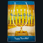 Bold Yellow Gold Hanukkah Menorah Peace Love Light Medium Gift Bag<br><div class="desc">“Peace, love & light.” A close-up photo illustration of a bright, colourful, yellow and gold artsy menorah helps you usher in the holiday of Hanukkah in style. Feel the warmth and joy of the holiday season whenever you use this cute and fun personalised medium size gift bag. Matching cards, postage,...</div>
