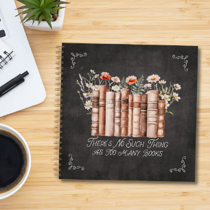 Books with Flowers and Quote on Black Notebook