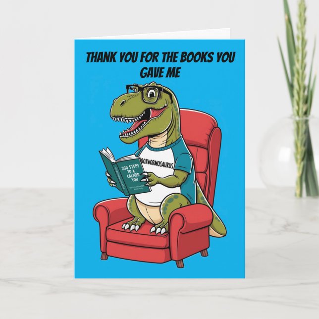 Bookwormosaurs rex sitting in chair reading book card (Front)