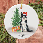 Border Collie Santa Dog Personalised Christmas Ceramic Tree Decoration<br><div class="desc">Decorate your tree or give a special gift this holiday season with this border collie santa dog christmas ornament, and matching decor. This border collie christmas ornament features a watercolor dog in a santa hat and tree. Personalise with name front, year back. This border collie christmas ornament will be a...</div>