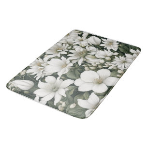 Botanical white flowers on green leaves bath mat