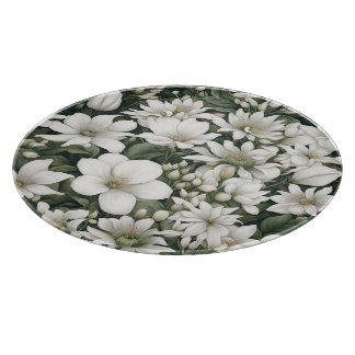 Botanical white flowers on green leaves cutting board