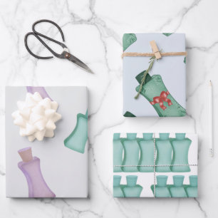 Bottles for cosmetics in green colours with bows wrapping paper sheet