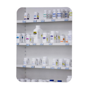 bottles on the shelves at a pharmacy magnet