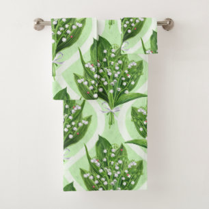 Bouquet of lilly of the valley flowers on green bath towel set