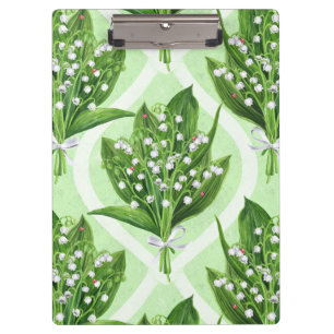 Bouquet of lilly of the valley flowers on green clipboard