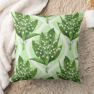 Bouquet of lilly of the valley flowers on green cushion