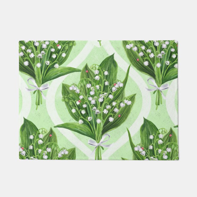 Bouquet of lilly of the valley flowers on green doormat (Front)