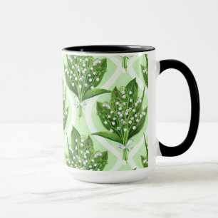 Bouquet of lilly of the valley flowers on green mug