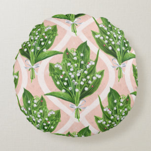Bouquet of lilly of the valley flowers on green round cushion