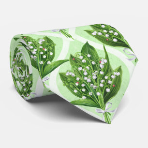 Bouquet of lilly of the valley flowers on green tie
