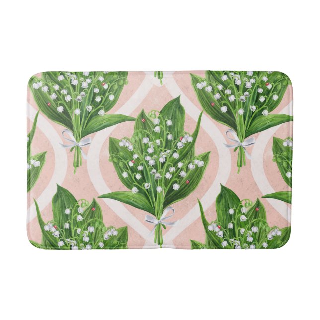 Bouquet of lilly of the valley flowers on pink bath mat (Front)