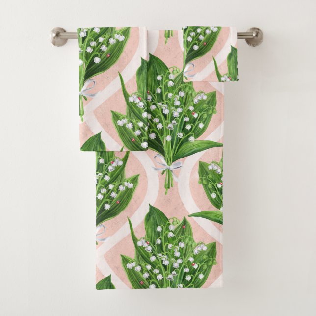 Bouquet of lilly of the valley flowers on pink bath towel set (Insitu)