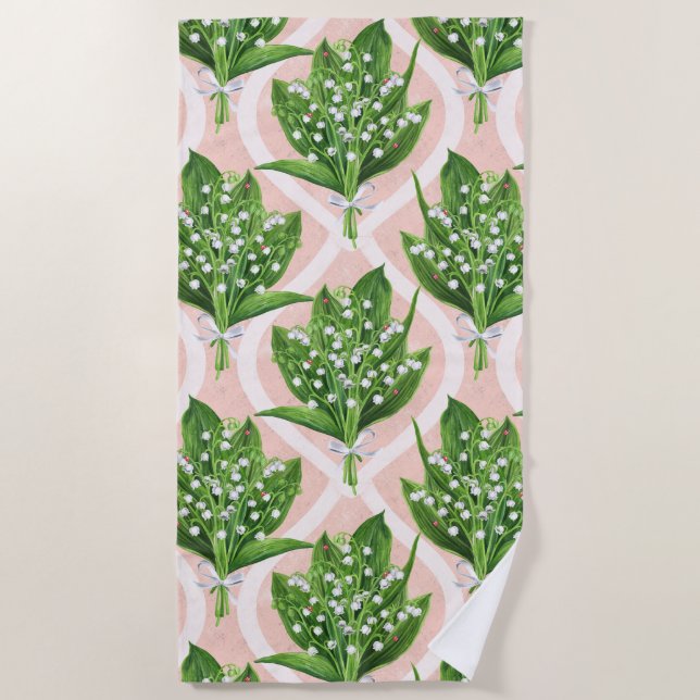 Bouquet of lilly of the valley flowers on pink beach towel (Front)