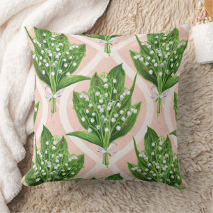 Bouquet of lilly of the valley flowers on pink cushion