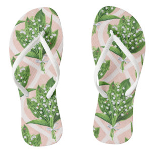 Bouquet of lilly of the valley flowers on pink flip flops