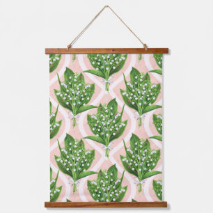 Bouquet of lilly of the valley flowers on pink hanging tapestry