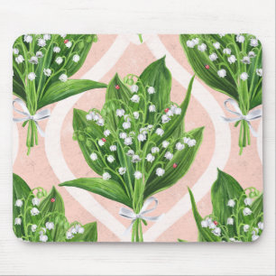 Bouquet of lilly of the valley flowers on pink mouse mat
