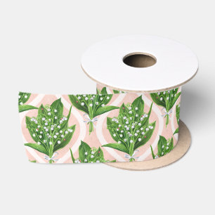 Bouquet of lilly of the valley flowers on pink satin ribbon