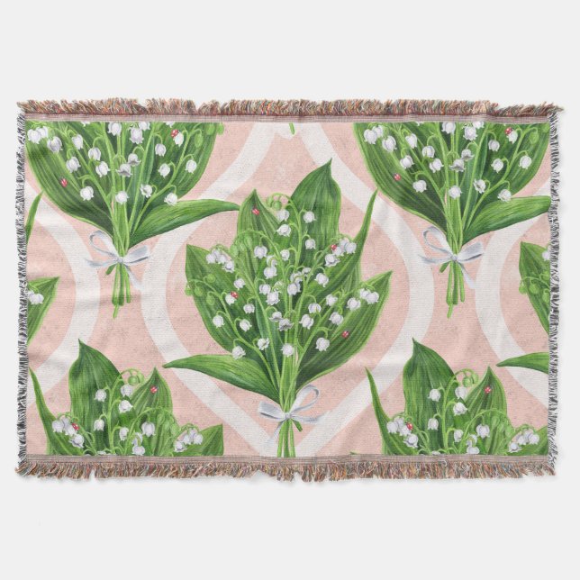 Bouquet of lilly of the valley flowers on pink throw blanket (Front)