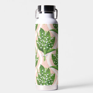 Bouquet of lilly of the valley flowers on pink water bottle