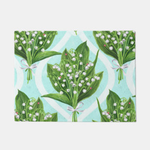 Bouquet of lily of the valley flowers on blue doormat