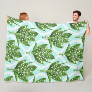 Bouquet of lily of the valley flowers on blue fleece blanket
